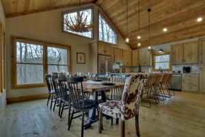 a kitchen and dining room with a table and chairs at A Great Escape in Ellijay