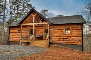 a log cabin with a porch and a deck at A Great Escape in Ellijay