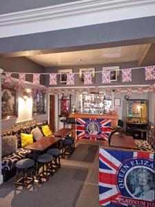 a bar with british flags on the wall at Hawthorn House in Blackpool