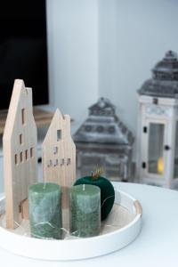 a small figurine of buildings and a green plant at Zoe's House in Polykárpion