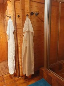 a bathroom with a shower and towels hanging on a wall at Apartment-Top Lage Köln (Hürth) in Hürth