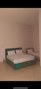 Een bed of bedden in een kamer bij Hotel Tani