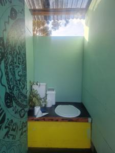 a bathroom with a white toilet in a room at Coastal Glamp at Bellarine Estate winery in Bellarine