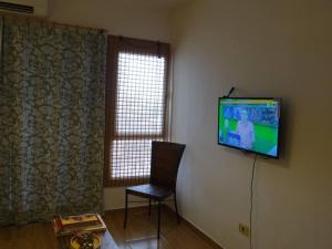 TV o dispositivi per l'intrattenimento presso Best location ! Apt privado 2 hab con AC Completamente equipado en Asuncion