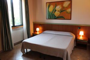 A bed or beds in a room at Villa Giglio