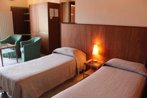 A bed or beds in a room at Villa Giglio
