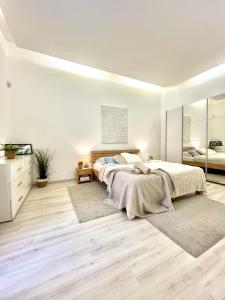 a bedroom with two beds and a mirror at JAMES BOND Apartment TOP Location Air Conditioned in Bratislava