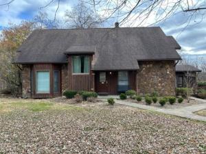 a brick house with a black roof at Luxury Cabin #21 With Hot Tub and Jacuzzi on Patoka Lake in Southern Indiana in Paoli
