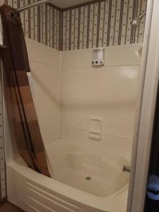 a shower with a glass door in a bathroom at Family Style Home #22 on Patoka Lake in Southern Indiana in Eckerty +4 photos