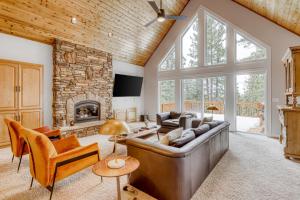 a living room with a couch and a fireplace at Canterbury Lodge in Kings Beach