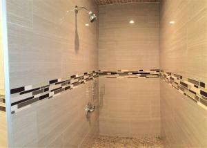 a bathroom with a shower with a glass door at 6B Best Location, 4 bedrm, 2 bathrm Beach Block in Seaside Heights +20 photos