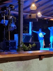 a stage with two people standing on a stage at JAYANDRA HOLIDAY BUNGALOW in Waga