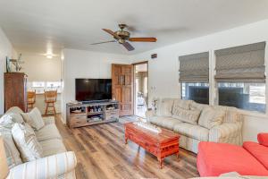 a living room with two couches and a tv at Pet-Friendly Higden Getaway Less Than 1 Mi to Marina! in Fairfield Bay