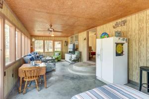 a kitchen and living room of a house with a refrigerator at Pet-Friendly Higden Getaway Less Than 1 Mi to Marina! in Fairfield Bay