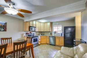 a kitchen with a table and a dining room at St Ann Townhome Less Than 1 Mi to International Airport! in Edmundson