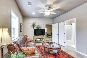 a living room with a leather couch and a tv at Pet-Friendly Dover Cottage w/ Deck + Mtn Views! in Dover