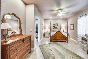 a bedroom with a bed and a large mirror at Pet-Friendly Dover Cottage w/ Deck + Mtn Views! in Dover