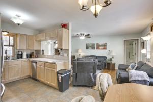 a kitchen and living room with a table and chairs at Single-Story Gillette Home Walk to Lake and Trails! in Gillette