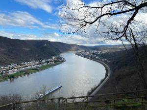 arial view of a river with a city and mountains at Traumpfade in Boppard +13 photos