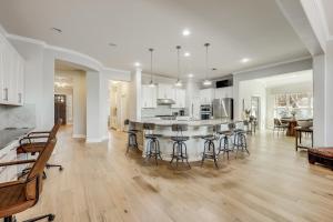 a kitchen and living room with a table and chairs at Immaculate, family friendly home in SW Austin in Austin