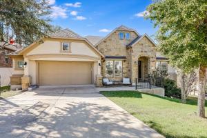 a house with a driveway and a garage at Immaculate, family friendly home in SW Austin in Austin