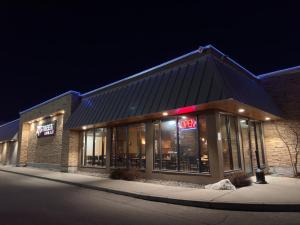 a store front of a building at night at Divya Sutra Plaza and Conference Centre, Vernon, BC in Vernon