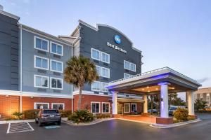 a rendering of a hotel with a gas station at Best Western Airport Inn & Suites in Charleston