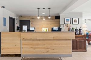 a store with a wooden counter in a room at Country Inn & Suites by Radisson, Saskatoon, SK in Saskatoon