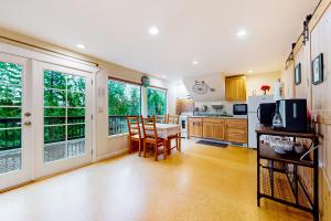 a kitchen and dining room with a table and chairs at The Garden Home in Issaquah