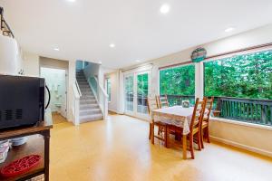 a kitchen and dining room with a table and chairs at The Garden Home in Issaquah