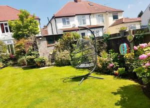 a shopping cart in the yard of a house at Wembley wow house in Preston