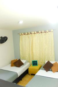 Giường trong phòng chung tại Casa Mostaza