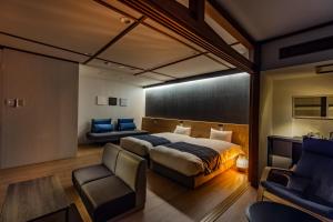 Кровать или кровати в номере AWA Nishi-Izu