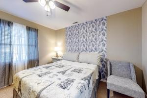 a bedroom with a bed and a ceiling fan at The Palms --- 36507 Palm Dr #2102 in Rehoboth Beach