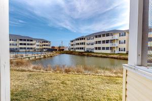 a view from a window of a river with apartment buildings at The Palms --- 36507 Palm Dr #2102 in Rehoboth Beach
