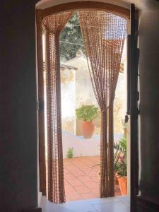 an open door with a view of a patio at Casa Tranquila Barrada in Alcoutim