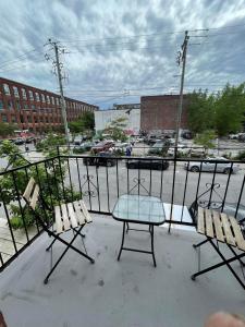 a patio with two chairs and a table on a balcony at 450$ 7nights // Full Kitchen // Room B in Montréal