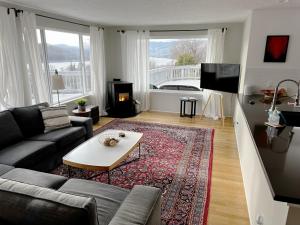 a living room with a couch and a table at Point Lyle home in Mosier