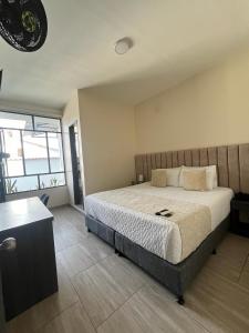 Postel nebo postele na pokoji v ubytování Hotel Le Falep & Spa