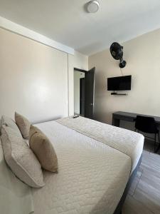 Postel nebo postele na pokoji v ubytování Hotel Le Falep & Spa