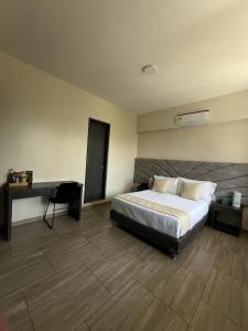 Postel nebo postele na pokoji v ubytování Hotel Le Falep & Spa
