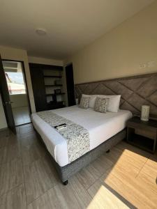 Postel nebo postele na pokoji v ubytování Hotel Le Falep & Spa