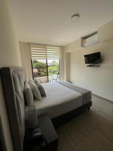 Postel nebo postele na pokoji v ubytování Hotel Le Falep & Spa