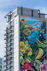 a building with a mural on the side of it at SkyGarden Nunciatura Luxury Apartment in San José