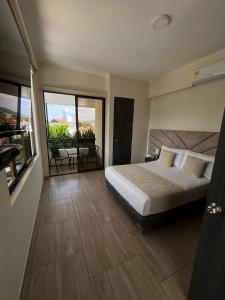 Postel nebo postele na pokoji v ubytování Hotel Le Falep & Spa