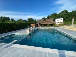 a swimming pool with a gazebo at CASA FINCA CERCANA A CTG in Turbaco