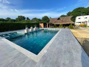 a swimming pool in the middle of a yard at CASA FINCA CERCANA A CTG in Turbaco