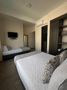 Postel nebo postele na pokoji v ubytování Hotel Le Falep & Spa