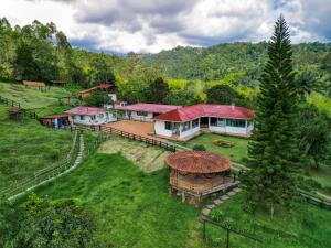 an aerial view of a house in a field at Finca Currucutu in Salento