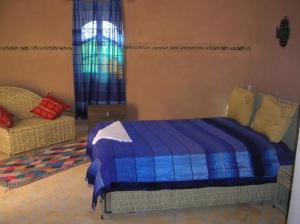 En eller flere senge i et værelse på Relais Hamada Du Draa